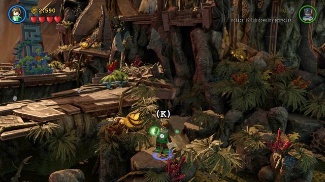 When stepping off the bridge, as Green Lantern, fly to the rock on the right and dig up a flower from the ground - Minikits - Need for Greed - secrets - LEGO Batman 3: Beyond Gotham - Game Guide and Walkthrough