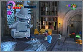 Get onto the right balcony once more- destroy the shelf by the wall - a part of the wall will fall down and a spider will appear behind it - LEGO Harry Potter Years 1-4: Year 1 Part 2 - Walkthrough - Walkthrough - LEGO Harry Potter Years 1-4 Guide & Walkthrough