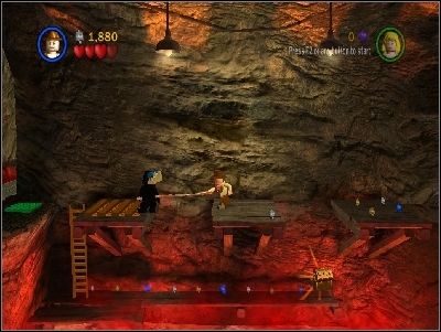 Jump on the other side and use your whip to take LEGO piece from the green pad - Chapter 4 - Free the Slaves - part 1 - The Temple of Doom - LEGO Indiana Jones: The Original Adventures - Game Guide and Walkthrough