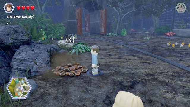 As Grant, walk to the pile of ground shown on the picture and dig up the bricks from it - Tyrannosaurus Enclosure | Jurassic Park - secrets in free roam - Jurassic Park - secrets in free roam - LEGO Jurassic World Game Guide & Walkthrough