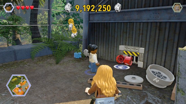 Walk behind the building and destroy all the barrels that block access to the passage - Communications Center | Jurassic Park - The Lost World - secrets in free roam - Jurassic Park - The Lost World - secrets in free roam - LEGO Jurassic World Game Guide & Walkthrough