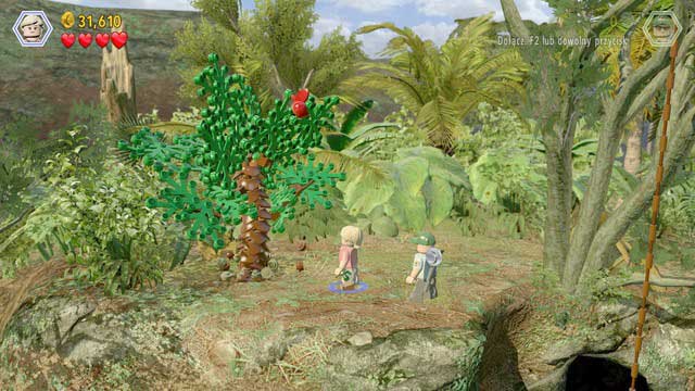 After you smash the green tree there, collect the blue items and follow the blue trail to the other side of the elevation - Welcome to Jurassic Park | Jurassic Park - walkthrough - Jurassic Park - walkthrough - LEGO Jurassic World Game Guide & Walkthrough