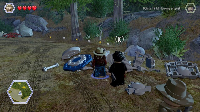 After you get the banana back, as any of the characters, approach the skeleton next to the cave and smash it - The Hunted | Jurassic Park - The Lost World - walkthrough - Jurassic Park - The Lost World - walkthrough - LEGO Jurassic World Game Guide & Walkthrough