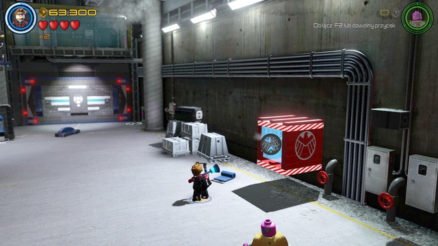 When youre in the garage, walk to the right side and as Hawkeye destroy the glass cover shown on the picture - Characters - A Loki Entrance - secrets - LEGO Marvels Avengers - Game Guide and Walkthrough