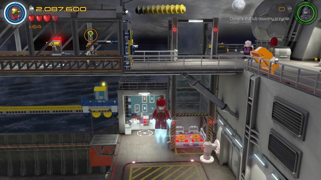 Fly up in the place shown on the picture, switch your character to Vision and walk towards the imprisoned worker on the left side - Minikits - Lack of Insight - secrets - LEGO Marvels Avengers - Game Guide and Walkthrough