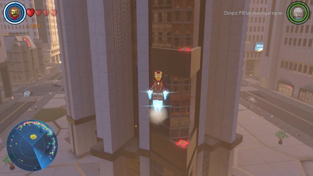 At the roof of the middle skyscraper you will find a container that can be opened by activating eight switches - Golden bricks - North Manhattan - secrets - LEGO Marvels Avengers - Game Guide and Walkthrough