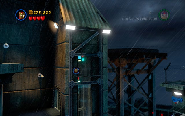 Turn right and fly to the lift pit - minikit is hidden at the top of it - Rock Up at the Lock Up | Minikit Sets - Minikit Sets - LEGO Marvel Super Heroes Game Guide & Walkthrough