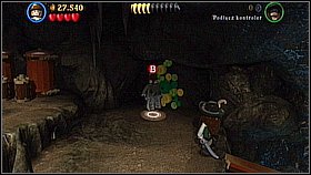 Bottle 7 - When you take the wood to the elevator and it goes up, you will notice a wall with an orange bar - Smuggler's Den - bottles - The Curse of the Black Pearl - LEGO Pirates of the Caribbean: The Video Game - Game Guide and Walkthrough