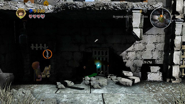 On the tower you should see an Orc with a sword which you will be able to use to free Gollum's hands - Osgiliath - Walkthrough - Act II - LEGO The Lord of the Rings - Game Guide and Walkthrough