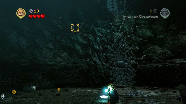 Now you have to quickly throw the phial at her by holding down (H) - it will knock her down to the ground - Cirith Ungol - Walkthrough - Act III - LEGO The Lord of the Rings - Game Guide and Walkthrough