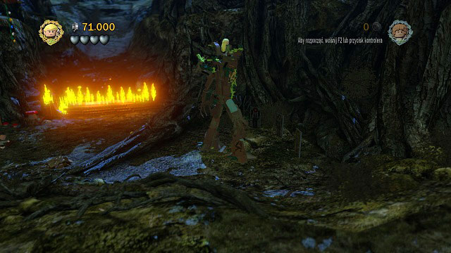 To the right of the burning log there are three cardboard Orcs - Track Hobbits - Collectibles - LEGO The Lord of the Rings - Game Guide and Walkthrough