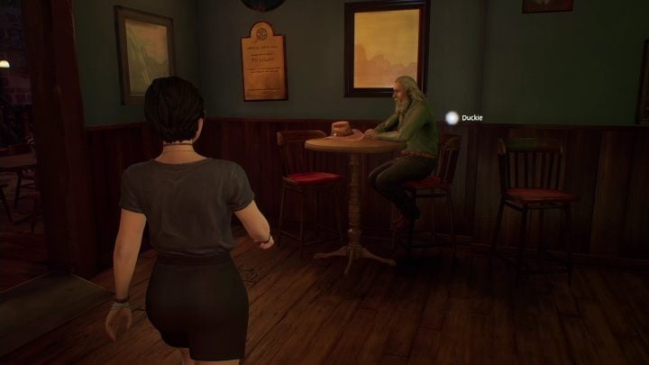 Duckie's sitting alone in the bar - Life is Strange True Colors: Outside the festival - walkthrough - Life is Strange True Colors: Chapter 4 Flicker - Life is Strange True Colors Guide