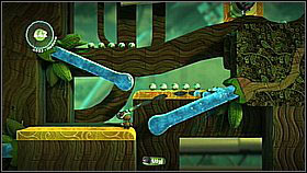 In order to extend the bridge, aim the water stream onto the cape on the other side of the pit - Patients Are a Virtue - Eve's Asylum - LittleBigPlanet 2 - Game Guide and Walkthrough