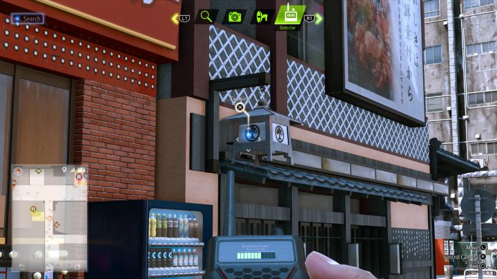 Use the detector to find The Walkin', Talkin' Hermit book on the restaurant lamp - Lost Judgment: Squirrel search Theater - all squirrels, map - Kamurocho - Lost Judgment Guide