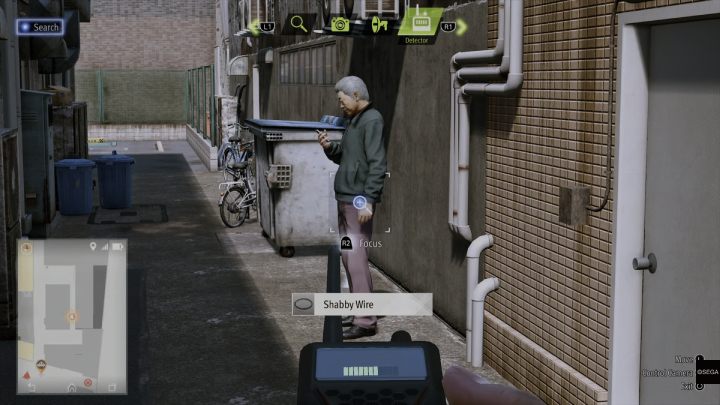 After the cutscene, use the detector again and follow its signal to the man standing in the alley behind Ohama Street - Lost Judgment: Dastardly Detective, Before the Torch Burns Out - walkthrough - Side Cases - Lost Judgment Guide