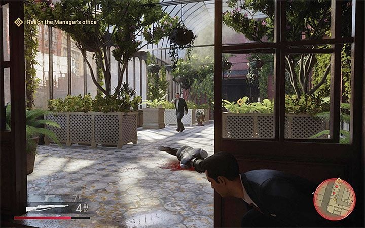 Follow the main corridor, but don't ignore the opportunity to visit the hotel rooms, which may contain First Aid points or ammunition crates - Mafia Definitive Edition: The Saint and the Sinner - walkthrough - Walkthrough - Mafia Definitive Edition Guide, Walkthrough