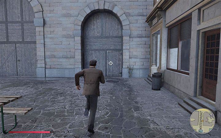 Walk to the right gate and notice that Tommy can break down the door - Mafia Definitive Edition: Trautenberg Sportr - hidden car, where to find - Cars - Mafia Definitive Edition Guide, Walkthrough