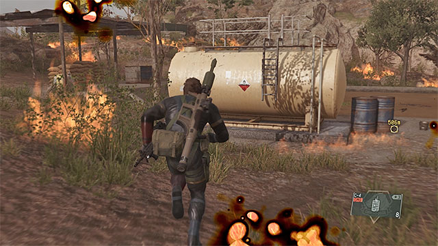 The best method for quickly stopping Man on Fire is to use the large fuel tank shown in the picture above - How to defeat the Man on Fire? | Walkthrough - Mission 20 - Voices - Metal Gear Solid V: The Phantom Pain Game Guide & Walkthrough