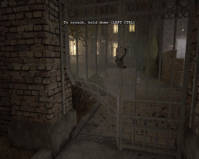 A damaged gate you need to crouch through - Administration Block | Walkthrough - Walkthrough - Outlast Game Guide & Walkthrough