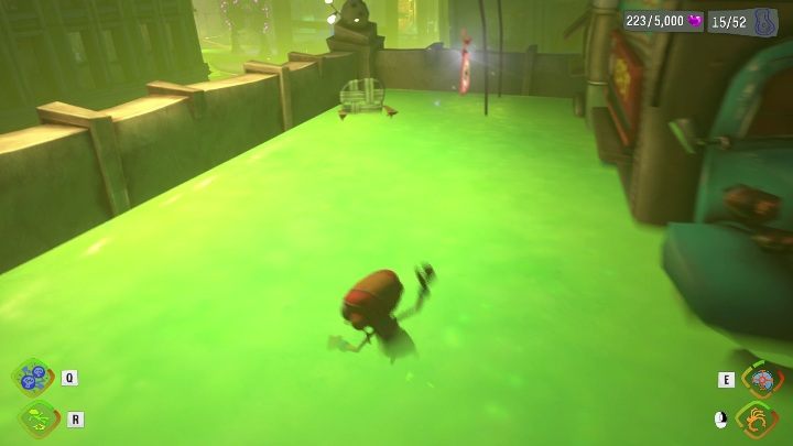 This tag is located on a building with green ooze - Psychonauts 2: Emotional Baggage, Strike City - where to find? - Strike City - Psychonauts 2 Guide