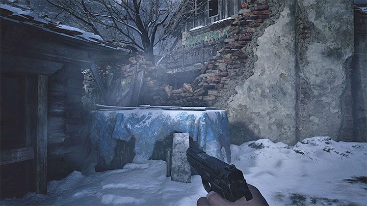 Stay in the hut where Elena and Leonardo are hiding and go through the window to get to the backyard - Resident Evil Village: Luizas House - walkthrough - Village - 1st visit - Resident Evil Village Guide