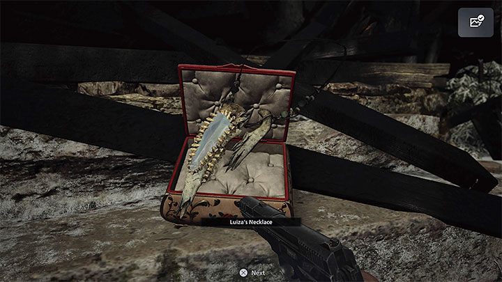 You can take the necklace out of the box - Resident Evil Village: Luizas Necklace Puzzle - Puzzle solutions - Resident Evil Village Guide