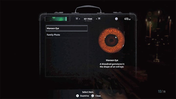 While examining the ring, focus on the chestnut eye - Resident Evil Village: Maroon Eye puzzle - Puzzle solutions - Resident Evil Village Guide