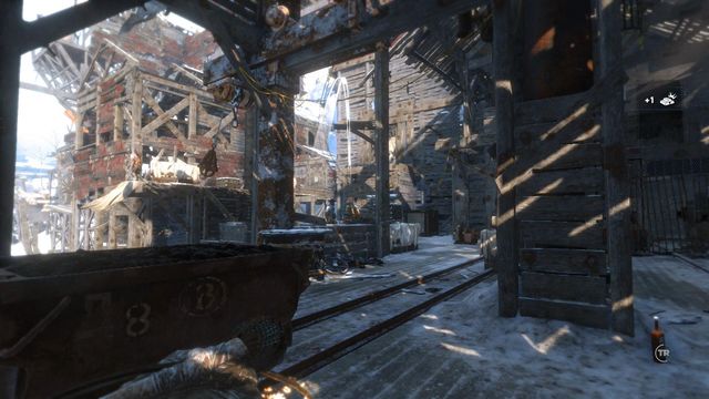 Several steps ahead, Lara will get an opportunity to try out her new weapon - Rise of the Tomb Raider: Climb the copper mill to reach the mine, walkthrough - Alone Again - Rise of the Tomb Raider Guide