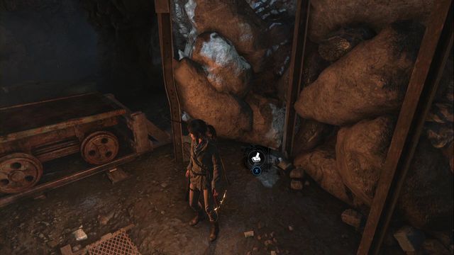 Next to the tracks and the cart, at the rocks, before the elevator shaft entrance - Rise of the Tomb Raider: Survival Caches, Abandoned Mine secrets, locations - Abandoned Mine - Rise of the Tomb Raider Guide