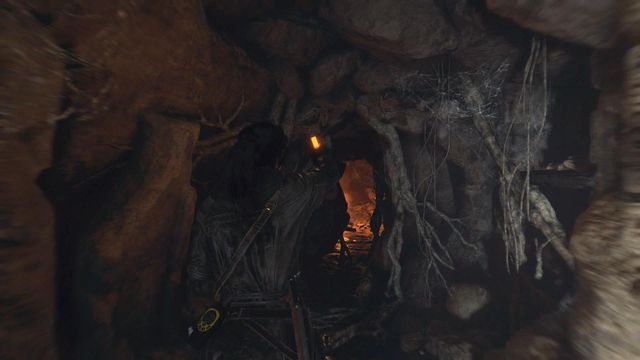 Cross the narrow passage in the wall of the cave - Rise of the Tomb Raider: Find an entrance into the archives, walkthrough - The Cathedral - Rise of the Tomb Raider Guide