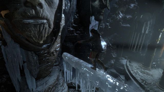 Jump over onto the lips of the huge head, from the beam covered with ice - Rise of the Tomb Raider: Find a way into the heart of Kitezh, walkthrough - Through the Glacier - Rise of the Tomb Raider Guide