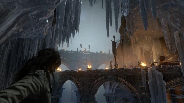 Past the camp, Lara will have to walk over a narrow ledge, while hugging the wall - Rise of the Tomb Raider: Find a way into the heart of Kitezh, walkthrough - Through the Glacier - Rise of the Tomb Raider Guide