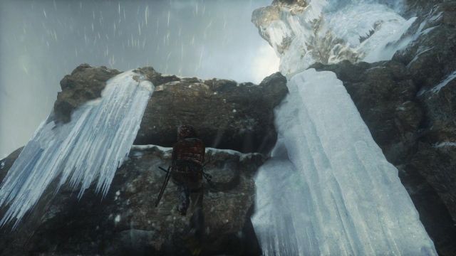 Lara will manage to stick the axe into the ice with enough strength to hold her - Rise of the Tomb Raider: Get to the top of the mountain walkthrough - Siberian Wilderness - Passageway - Rise of the Tomb Raider Guide