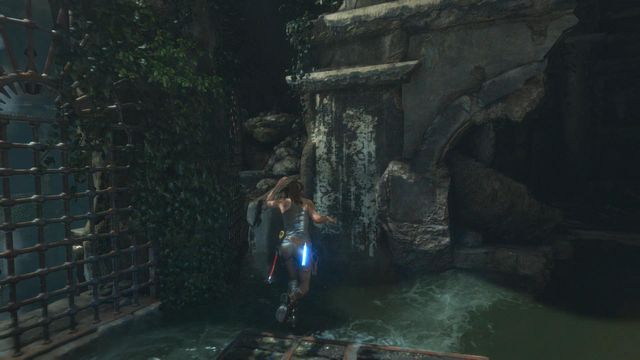 Jump again on the wooden platform and this time let the water wash you off - Rise of the Tomb Raider: Climb to the top of main chamber of tomb walkthrough - Syria - Lost tomb - Rise of the Tomb Raider Guide