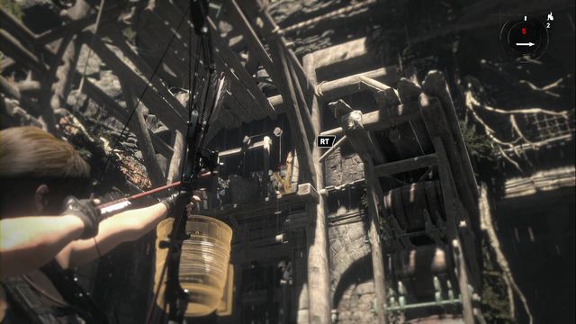 While close to the cart, look up, towards the bucket hanging above - Rise of the Tomb Raider: Tomb - House of the Afflicted 6/9, Geothermal Valley - Geothermal Valley - Rise of the Tomb Raider Guide