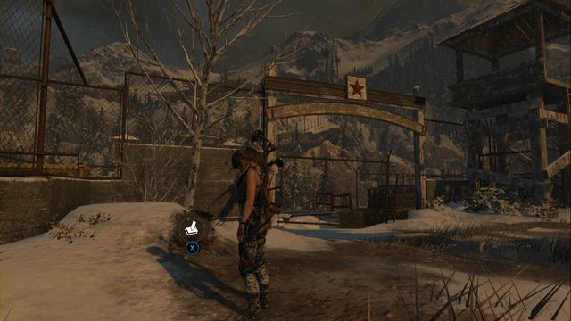In front of the gate, to the left of the road - Rise of the Tomb Raider: Survival Caches, Soviet Installation secrets, map, tips - Soviet Installation - Rise of the Tomb Raider Guide