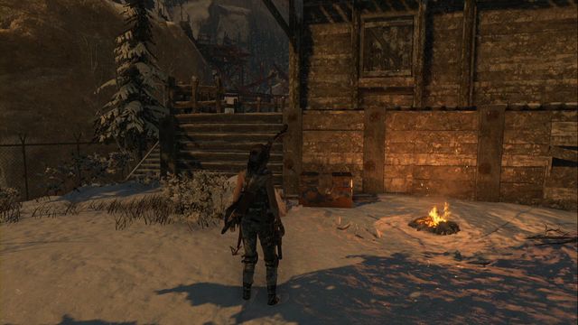 At the campfire in Logging Camp - Rise of the Tomb Raider: Chests, crypt treasures, Soviet Installation secrets - Soviet Installation - Rise of the Tomb Raider Guide