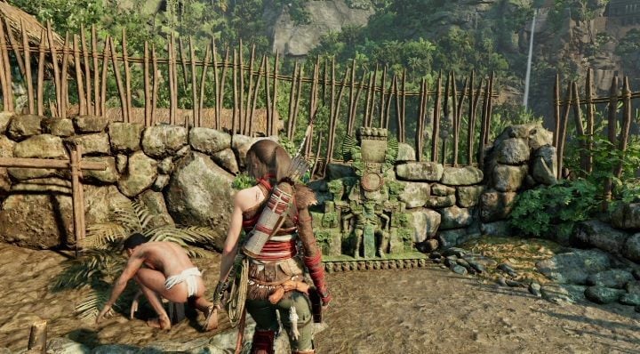 Mural First Contact is located under a wooden stone fence - Murals in The Hidden City | Secrets in Shadow of the Tomb Raider - The Hidden City - Shadow of the Tomb Raider Game Guide