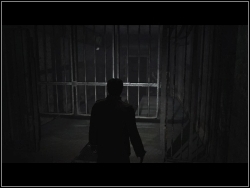 Jump over the fence on the left, move the blockade and pry open the door - Silent Hill - Lair - Silent Hill - Silent Hill: Homecoming - Game Guide and Walkthrough