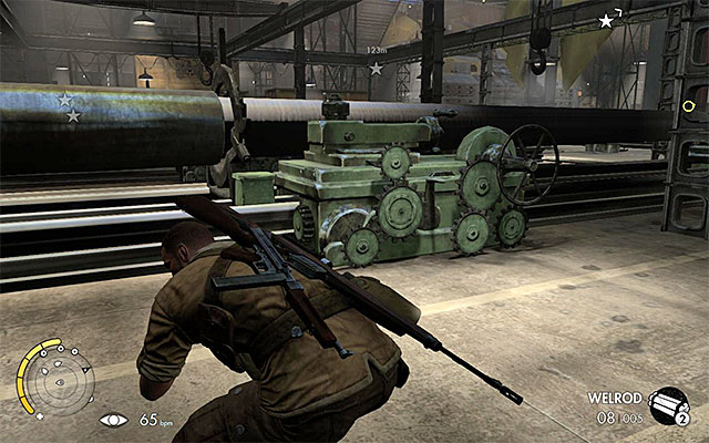 Exit the lift as quickly as possible - Sniper Elite 3 Afrika: Exploring the tank hall - Sniper Elite 3 Afrika: Mission 8 - Ratte Factory - Sniper Elite III: Afrika Game Guide