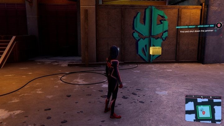 The Underground cache is located behind the wall with the Underground logo on it - Spider-Man Miles Morales: Underground hideouts - all locations, list - Laboratories and Hideouts - Spider-Man Miles Morales Guide
