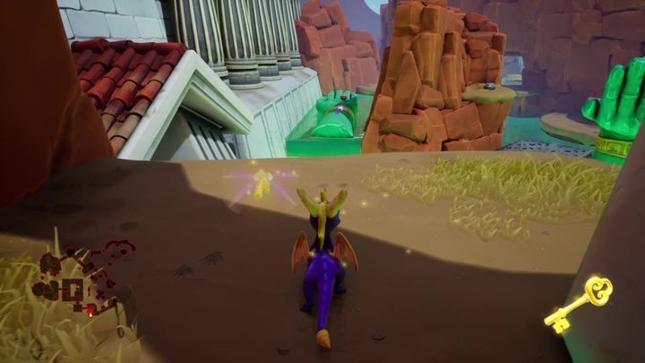 After sorting out the enemy, you will be able to glide onto a hand statue on the other side of the ravine - Desert Ruins | Spyro: Year of the Dragon Walkthrough - Midnight Mountain - Spyro Reignited Trilogy Guide