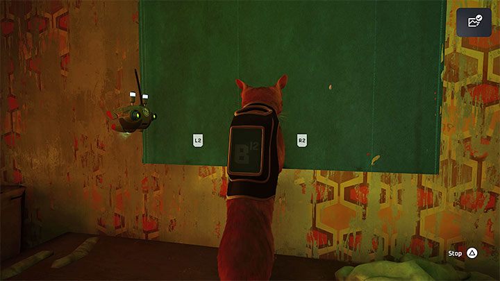 Interact with the blind and scratch it until it rolls up - Stray: The Slums, Chapter 4 - walkthrough - Walkthrough - Stray Guide, Walkthrough