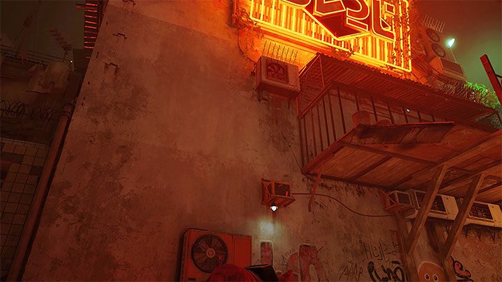 Reach the area under the large neon sign - there are 2 robots in this area throwing paint cans - Stray: Notebooks in The Slums - where to find? - FAQ - Stray Guide, Walkthrough