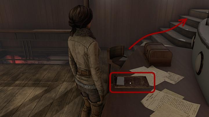 Approach the table found in the southern part of the room (the table is opposite to a stillage with the phonograph) and pick-up Captain Obos log book - Return to captain Obo and convince him to ferry the Jukolians | Chapter three | Walkthrough - Chapter three - Syberia 3 Game Guide