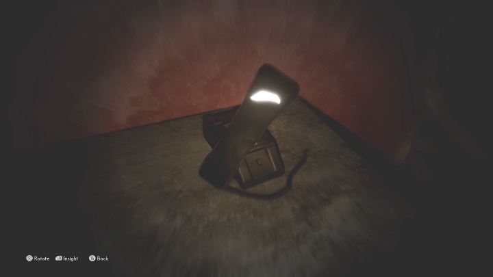 You need to walk up to the phone standing on the wooden cabinet, grab the handset, and position it so that the bright scratch starts pulsing/glowing - The Medium: Echoes of a mysterious caller - list - Secrets and Collectibles - The Medium Guide