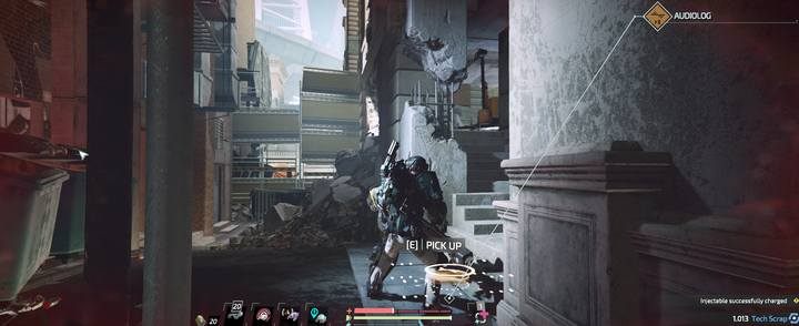 After passing by the doctor, at the gate leading north under military protection, in a ruined building behind the crates, you will find a small alley where the audiolog is located - Jericho - Downtown | Audiologs in The Surge 2 - Audiologs - The Surge 2 Guide