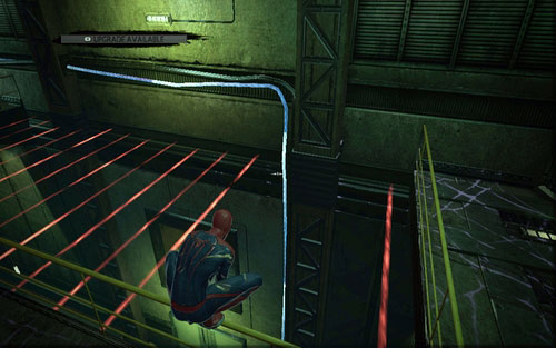 Head inside, go through the hole between the red lasers and grab the wall below - Chapter 07 - Spidey to the Rescue - Walkthrough - The Amazing Spider-Man - Game Guide and Walkthrough