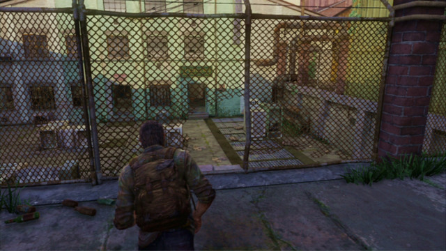 A bit further, you need to squeeze through a hole in the fence where Joel will take cover behind the crates automatically - The Last of Us: The Slum, The Quarantine Zone Walkthrough, map - The Quarantine Zone - The Last of Us Guide