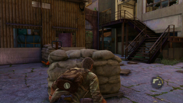 After you deal with the enemies, go downstairs to eliminate the third one on the ground floor of the warehouse - The Last of Us: The Slum, The Quarantine Zone Walkthrough, map - The Quarantine Zone - The Last of Us Guide